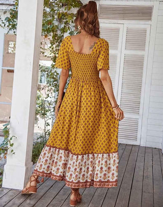 Elora – boho maxikleid mit floralem patchwork - print, quadrat - ausschnitt und volantrock - Cecile LavelleOrange