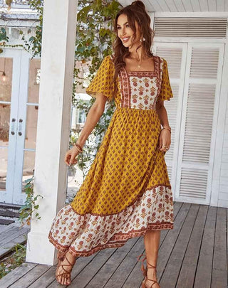 Elora – boho maxikleid mit floralem patchwork - print, quadrat - ausschnitt und volantrock - Cecile LavelleOrange