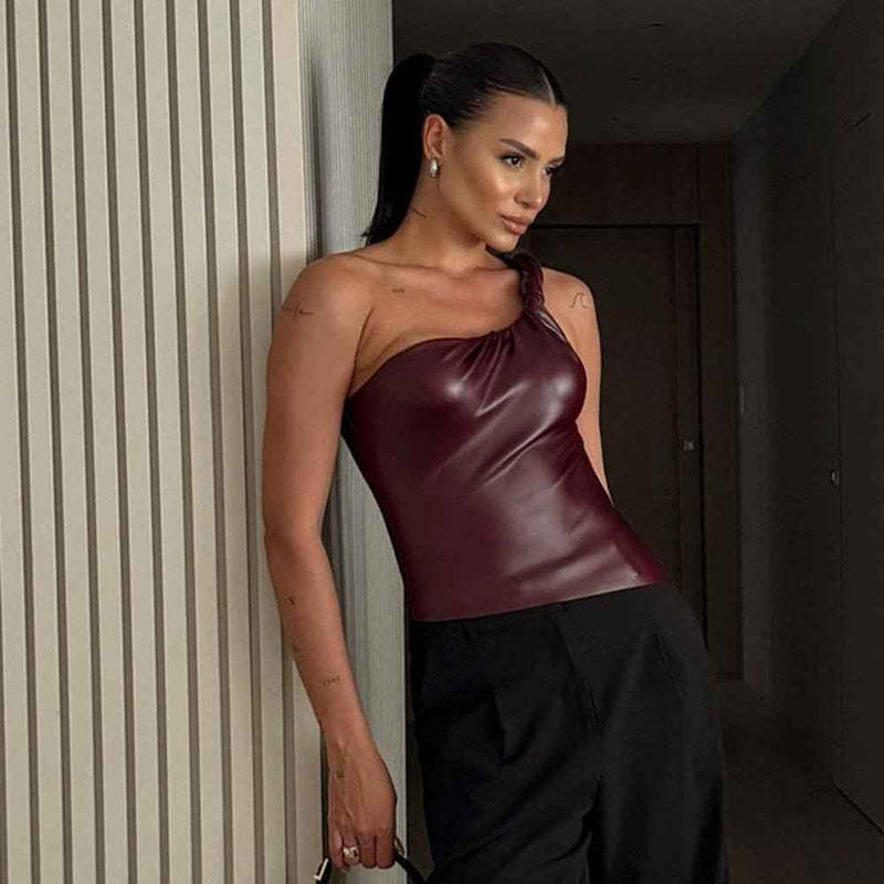 Lina – asymmetrical faux leather top with knotted strap