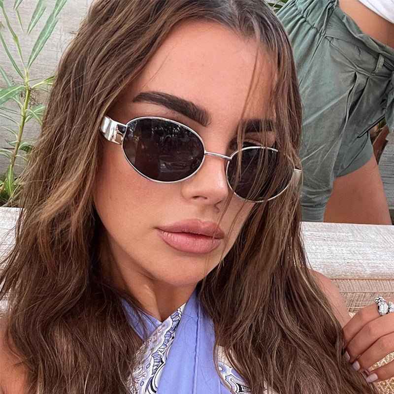Livia – oval sunglasses with silver details and slim frame
