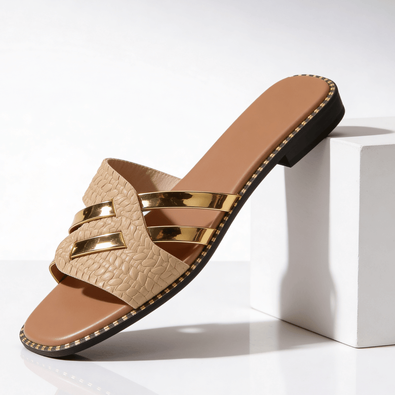 Flat women's sandals with straps and studs